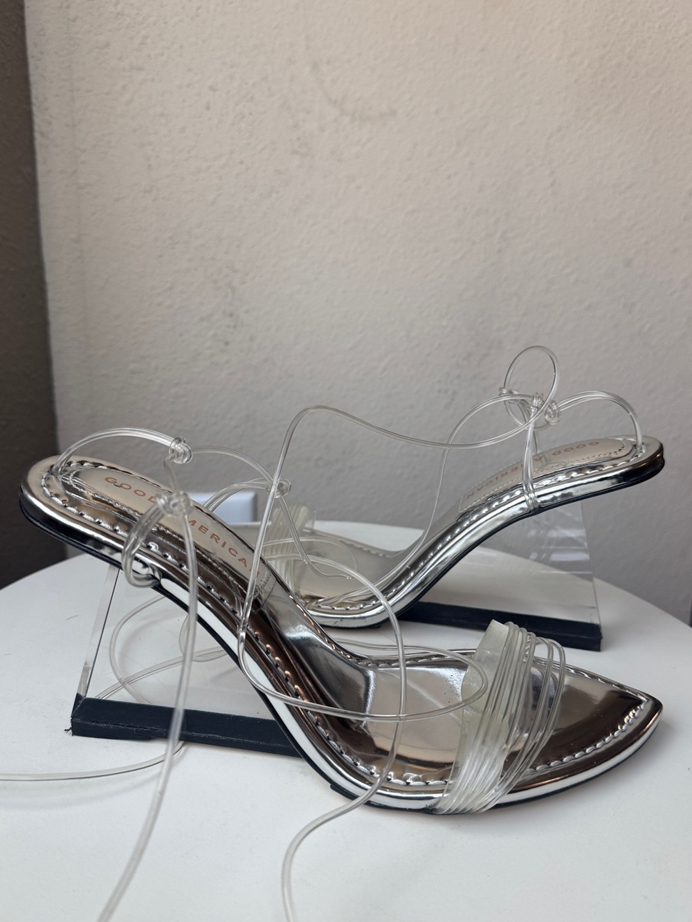 Good American Clear Strappy Slide Heels in Transparent/Silver